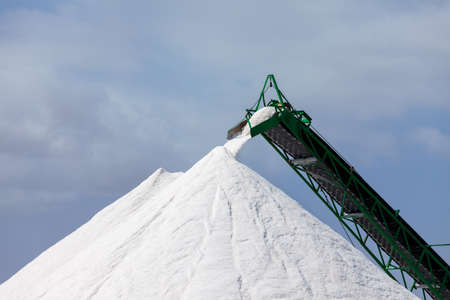 Extraction of salt  Salt mountains on blue sky の写真素材