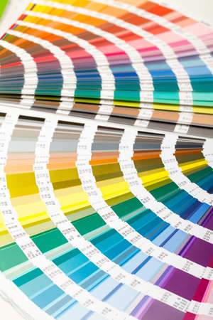 Fanned colour guide displaying a range of hues for all the spectral colours for use in interior design and decorationの写真素材