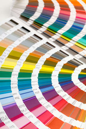Fanned colour guide displaying a range of hues for all the spectral colours for use in interior design and decorationの写真素材