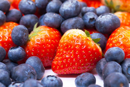 Heap Fresh Strawberries and Blueberries, closeupの写真素材