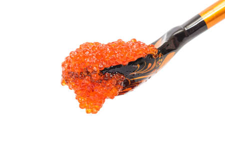 Red salted caviar with wooden spoon on a white backgroundの写真素材