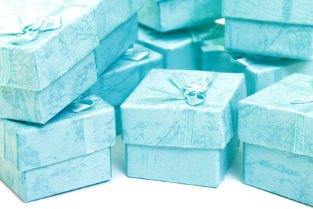 Cyan gift boxes closeup on white background