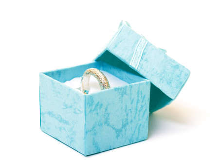 Cyan gift boxes with ring closeup on white backgroundの写真素材