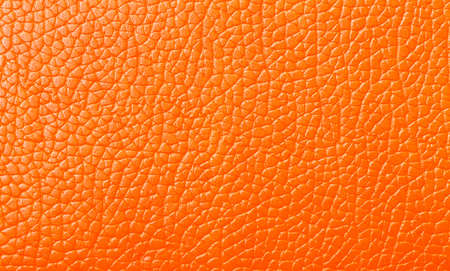 Orange Leather texture closeup, backdropの写真素材