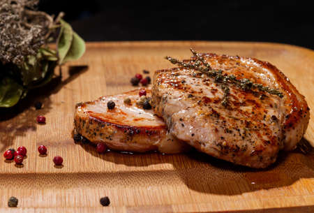 Grilled steak on wooden cutting boardの写真素材