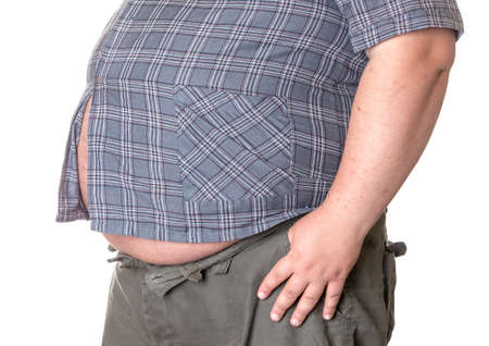 Fat man with a big belly, close-up part of the bodyの写真素材
