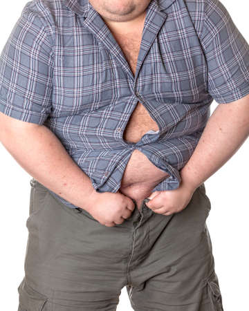 Fat man with a big belly, close-up part of the bodyの写真素材