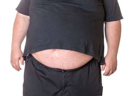 Fat man with a big belly, close-up part of the bodyの写真素材