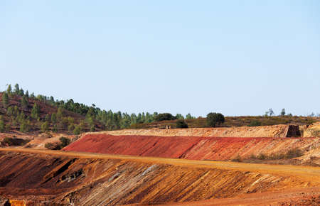 Copper mine tailings or refuse heaps remaining at a mine after the ore has been processedの写真素材
