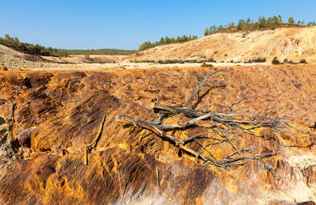 Earth dam wall with an empty dam in a dry dusty landscapeの写真素材