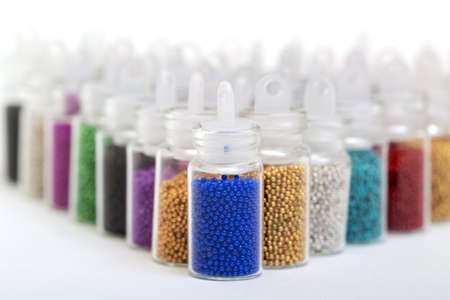 Small Glass Jars filled with Balls of Bead, closeupの写真素材