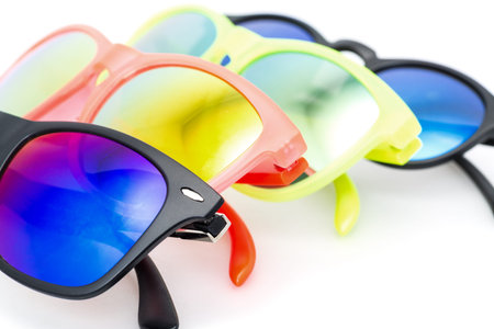Few Very Bright Sunglasses Eyewear, closeup on white background