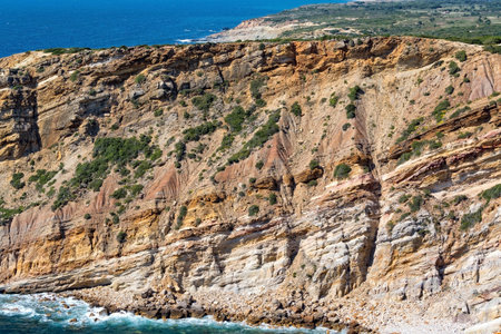 Rocky Beach and Sandstone Cliffs, Sesimbra, Portugalの写真素材