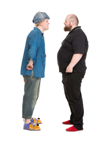 Actor Dressed as Fairy-Tale Hero Talking with Fatman, isolated on white backgroundの写真素材