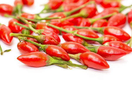 Heap of Ripe Red Peppers Piri-Piri, isolated on white background
