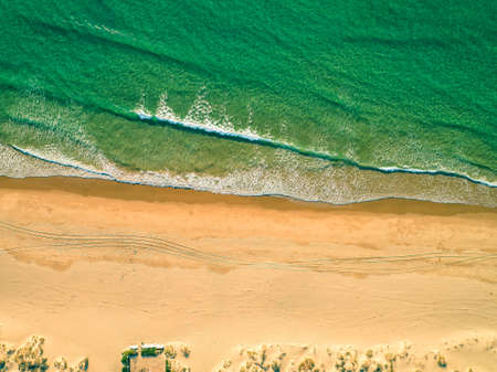 Aerial View Amazing Seascape with Small Waves on Sandy Beach, Portugalの写真素材