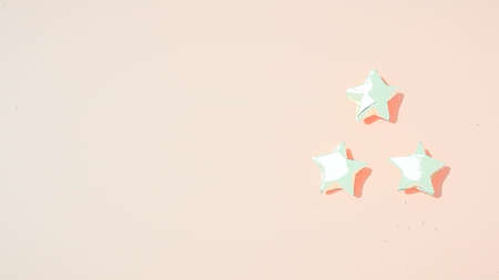 Paper stars Yellow background picture pink.の写真素材