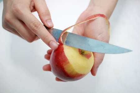 Red apple with peelの写真素材