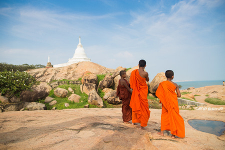 Yala, SRI LANKA - DECEMBER 30, 2014: Buddhist monks near Kirinda stupa temple near Yala in Sri Lankaのeditorial素材