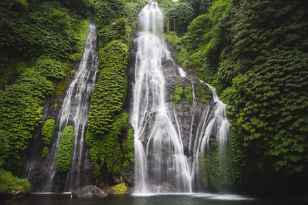 Secret Bali jungle Waterfall called Banyumalaの写真素材