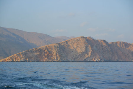 Oman sunset sea mountainsの写真素材