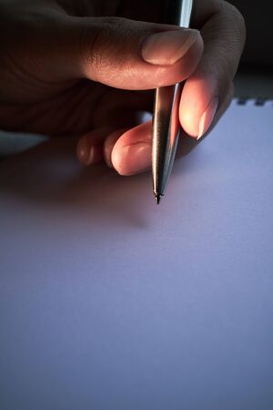 write with a pen in a notebookの写真素材