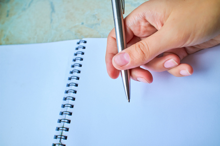 write with a pen in a notebookの写真素材