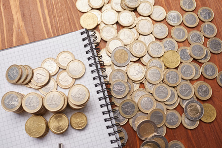 count coins with calculatorの写真素材