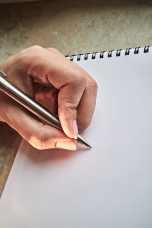 write with a pen in a notebookの写真素材