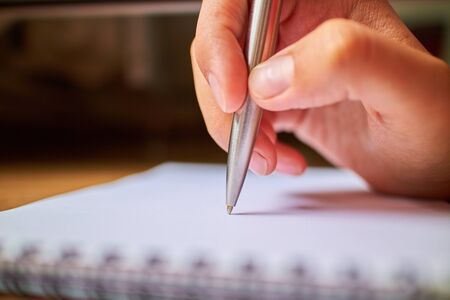 write with a pen in a notebookの写真素材