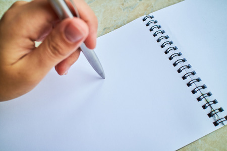 write with a pen in a notebookの写真素材