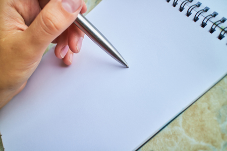 write with a pen in a notebookの写真素材