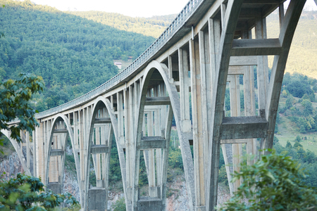 bridge over the river in the mountains of Montenegroの写真素材