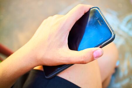 phone in a female handの写真素材