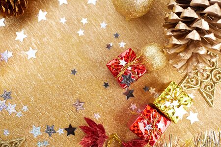 Christmas decorations on a gold backgroundの写真素材