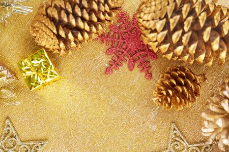Christmas decorations on a gold backgroundの写真素材