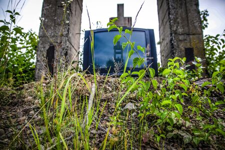 abandoned TV Urban with grassの写真素材