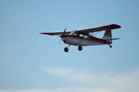 Light plane in flight, Palo Alto Airport, Californiaの写真素材
