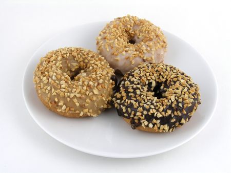 A trio of peanut-covered cake doughnutsの写真素材
