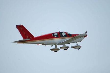 Light plane in flight, Palo Alto Airport, Californiaの写真素材