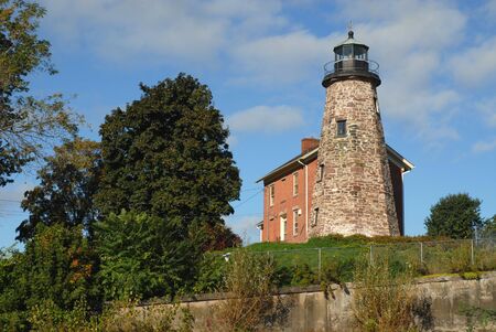 Historic stone lighthouse on Lake Ontario, Rochester, New Yorkの写真素材