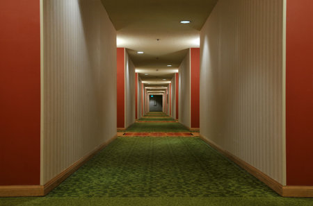 Look down a hotel corridorの写真素材