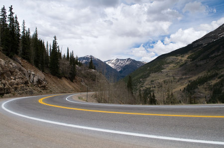 A curve in a highway through the mountains, Silverton, Coloradoの写真素材