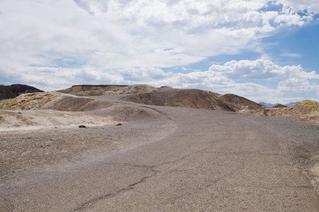 Curving road up a hill, Zabriskie Point, Death Valley National Park, Californiaの写真素材