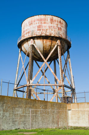 Water tower and prison wall, Alcatraz Penitentiary, Alcatraz Island, San Francisco Bay, Californiaの写真素材