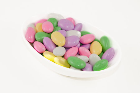 A dish of pastel colored Jordan almonds