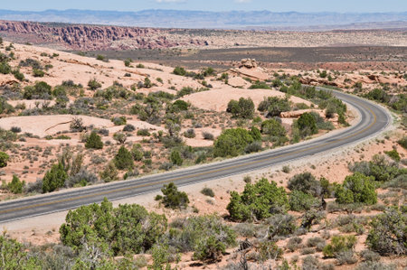 Road through the desert, Arches National Park, Moab, Utahの写真素材