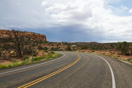 Curving road through the desert, Islands in the Sky, Canyonlands National Park, Utahの写真素材