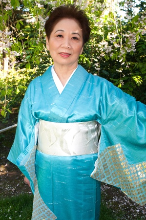 Mature woman in a traditional Japanese outfitの写真素材