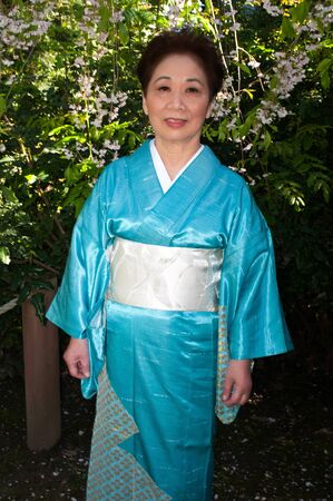 Mature woman in a traditional Japanese outfitの写真素材